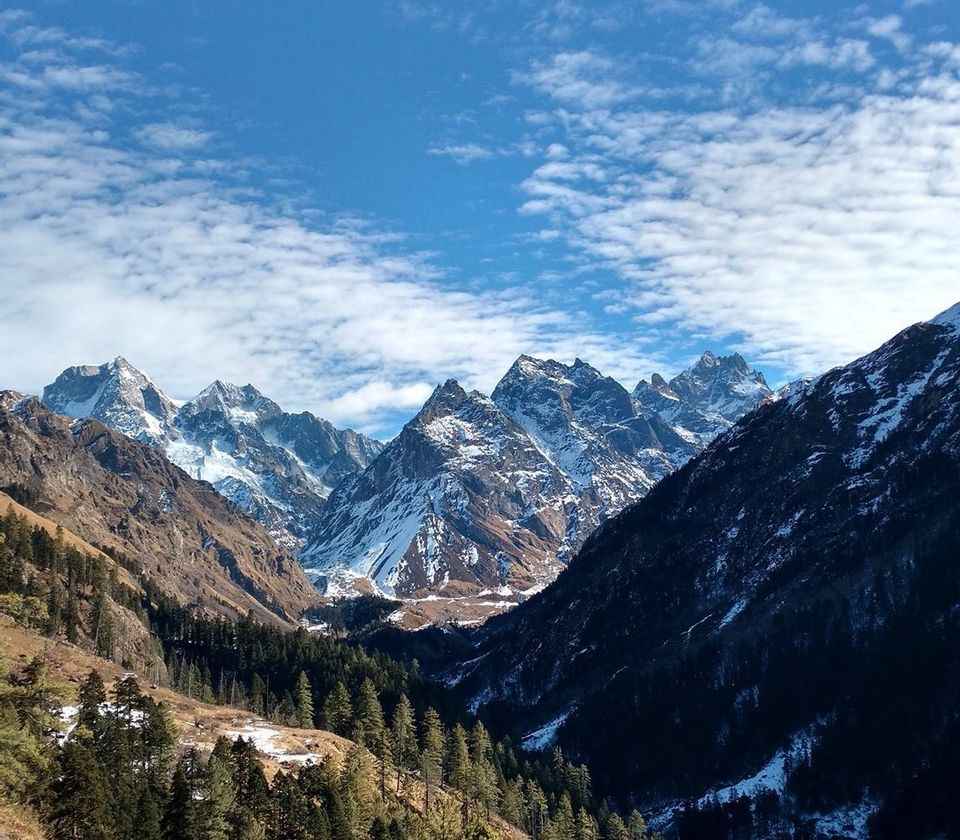 Scenic alpine meadows and snow-capped Hata Peak in Hata Valley near Har Ki Dun