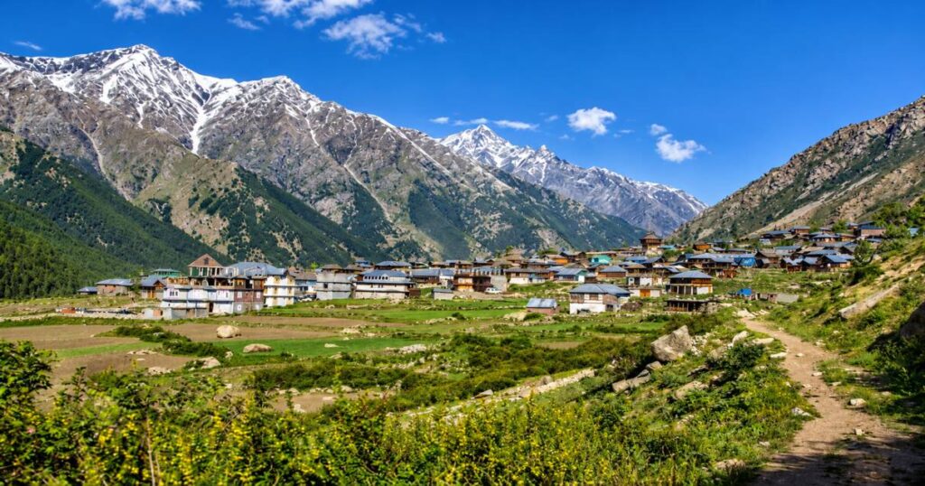 Traditional Garhwali mountain village nestled in the lush Himalayan valley on Har Ki Dun trek
