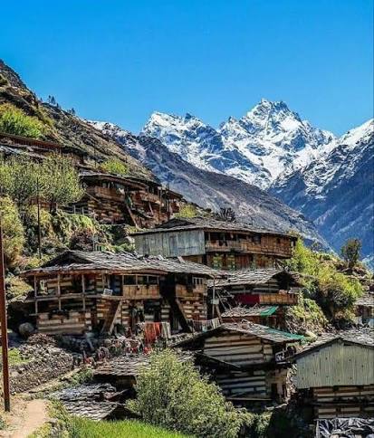 Ancient wooden houses and terraced fields in Osla village on the Har Ki Dun trek trail