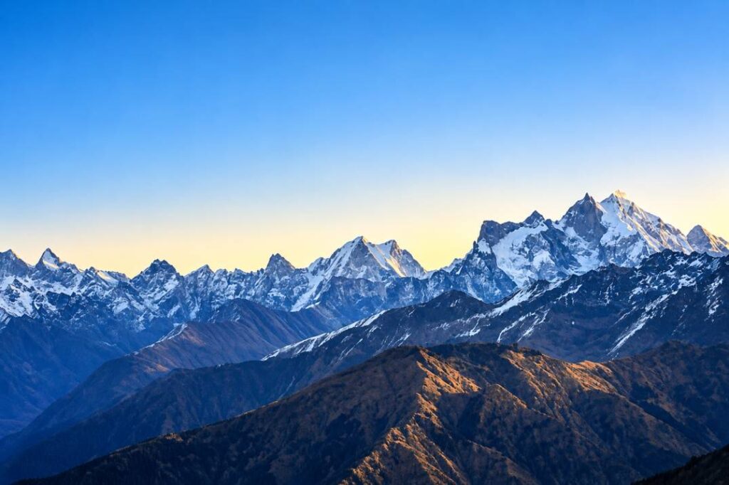 Majestic snow-capped Swargarohini Peak towering over Har Ki Dun valley in Garhwal Himalayas